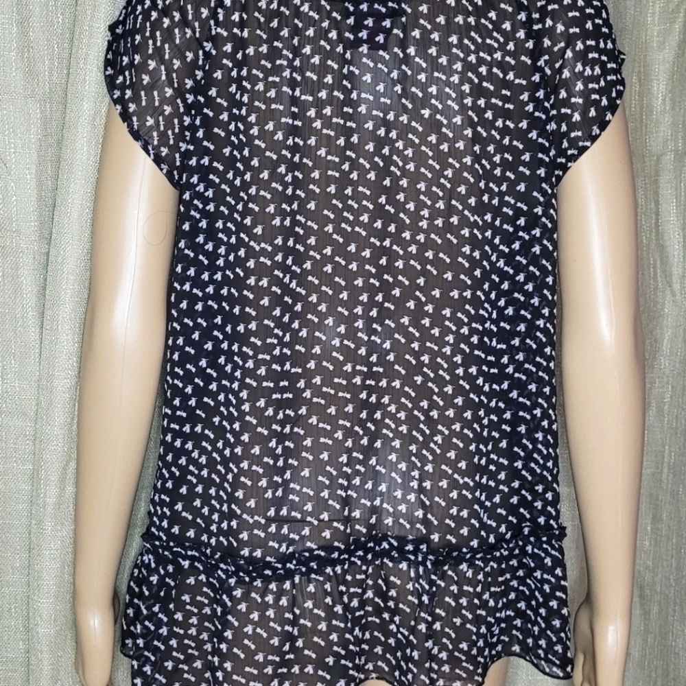 Black and white top. Size L. The brand is Fire and is 100% polyester. - Picture 4 of 4